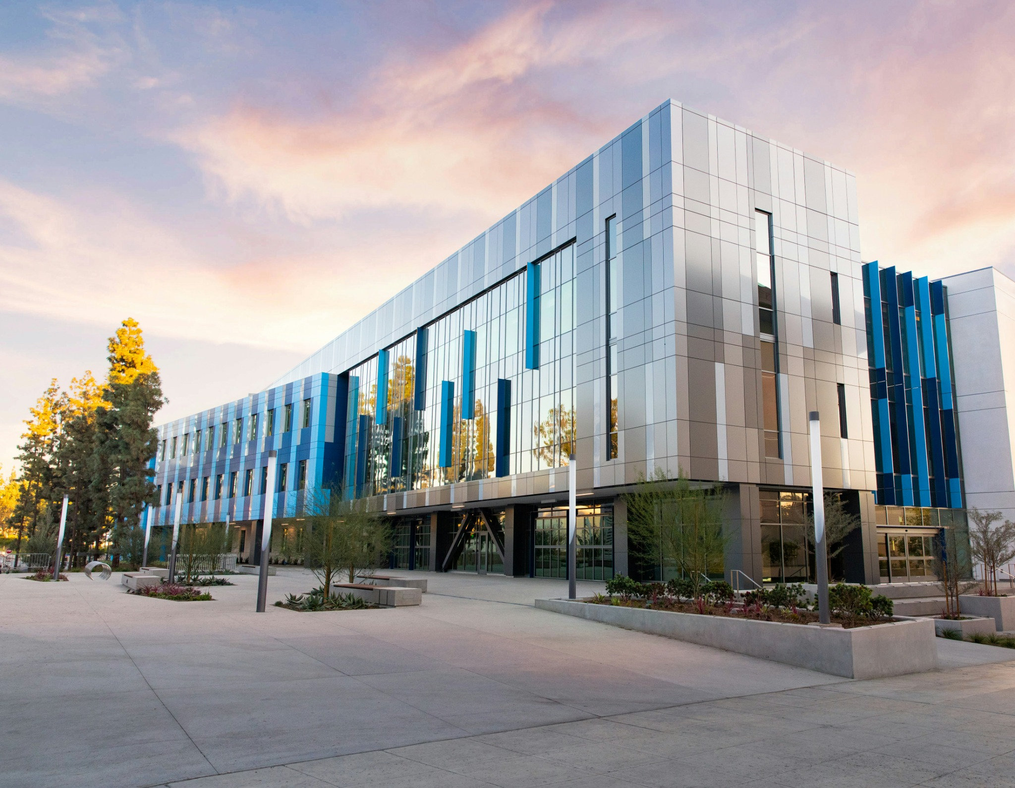 Modern commercial building surrounded by trees